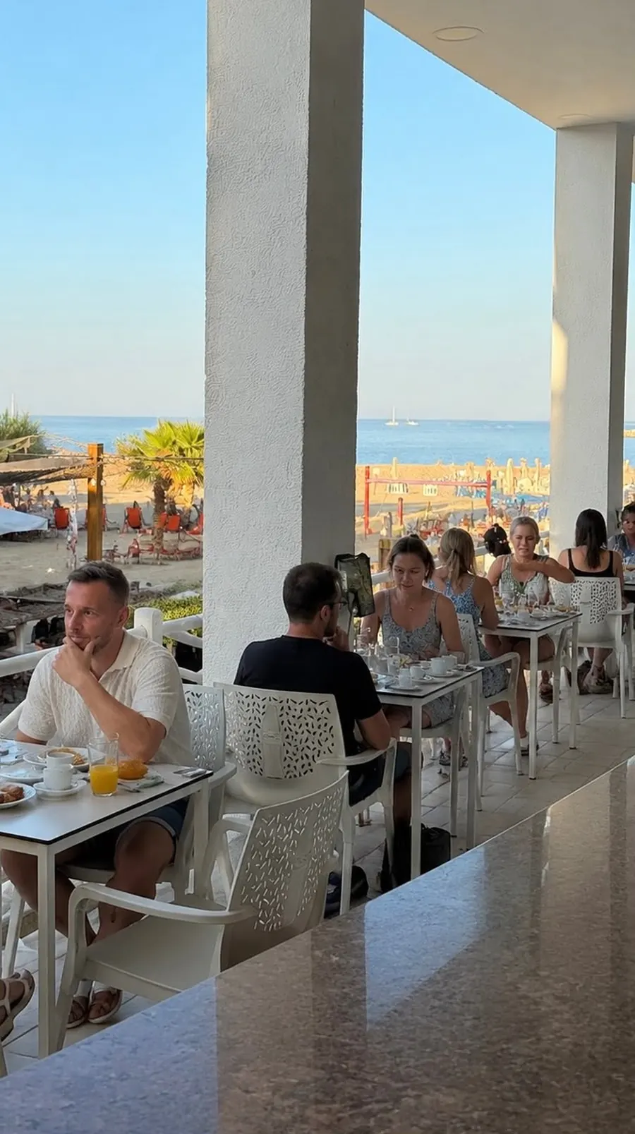 Breakfast on the terrace with a view of the beach